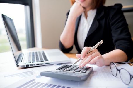 a woman using her calculator
