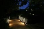 Illuminated walkway with white railing